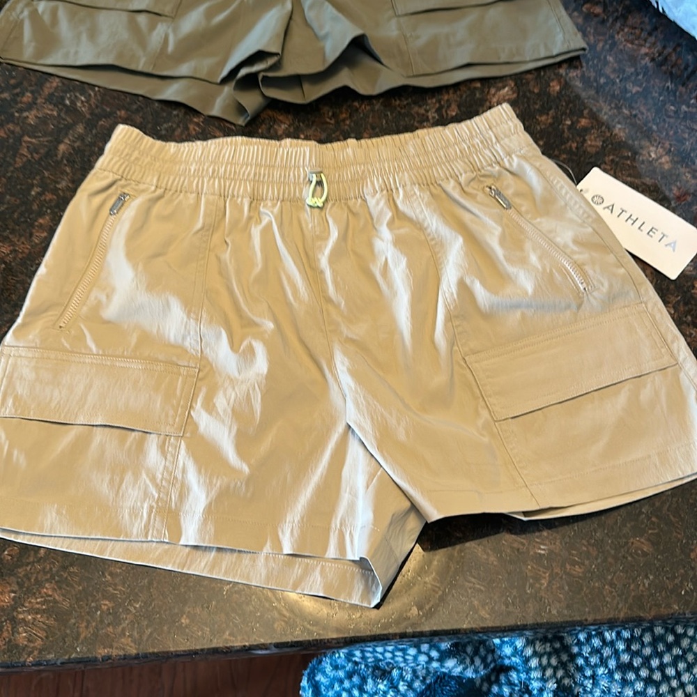 Two pair of Athletica cascade cargo Poplin shorts. Brand new with tags